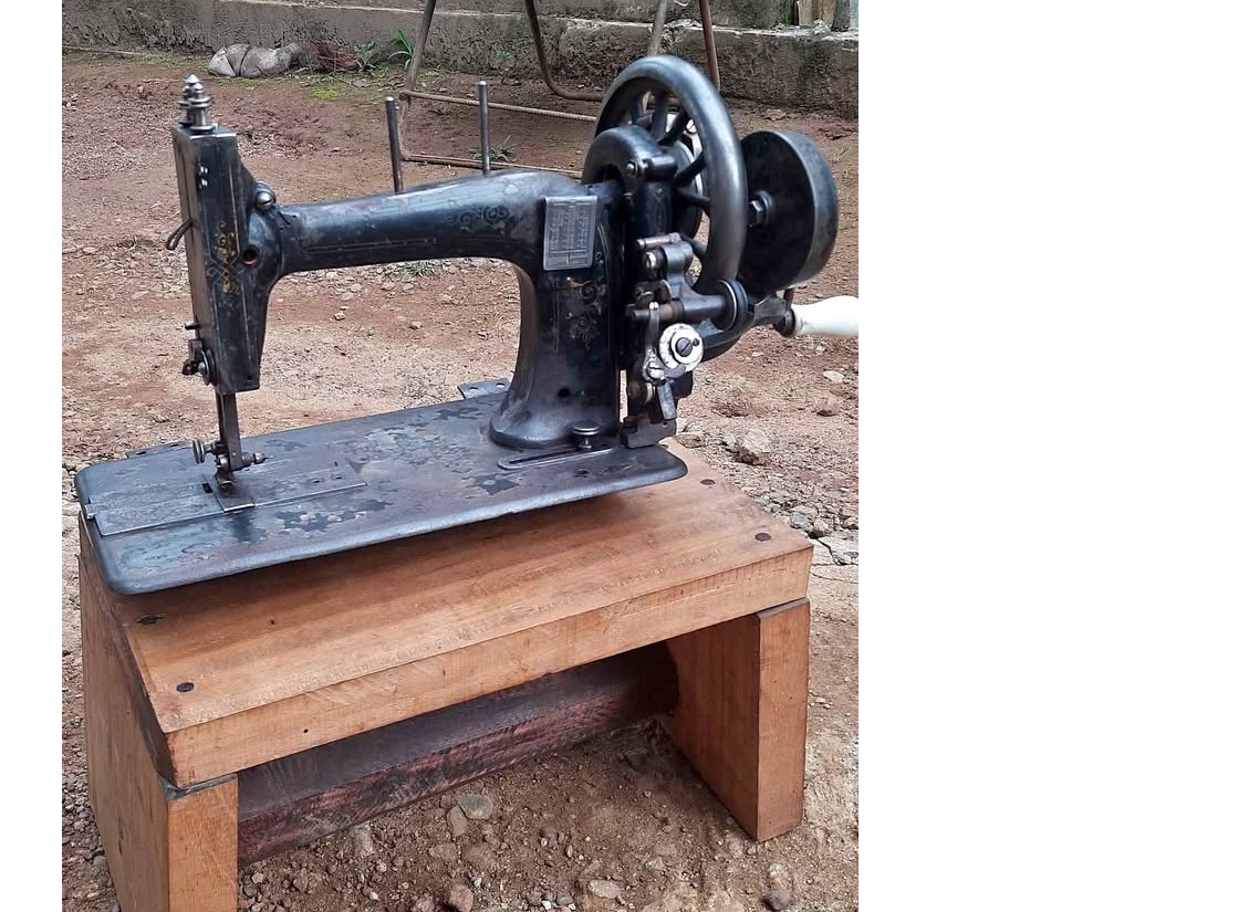 Old antique singer hand working sewing machine